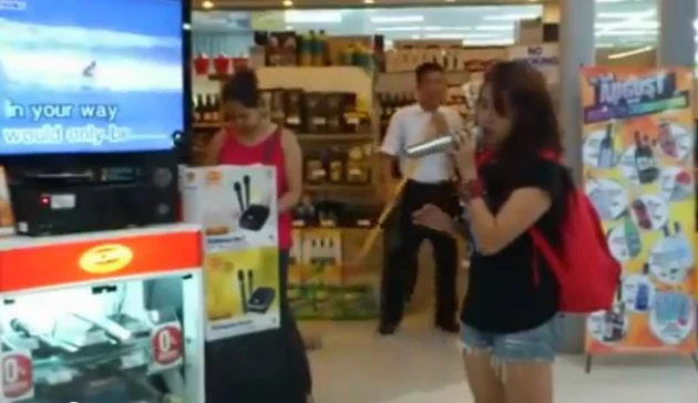 'Random Girl' 'Random Girl' sings karaoke at the mall