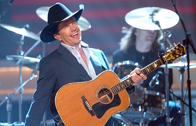 George Strait performs onstage George Strait performs onstage
